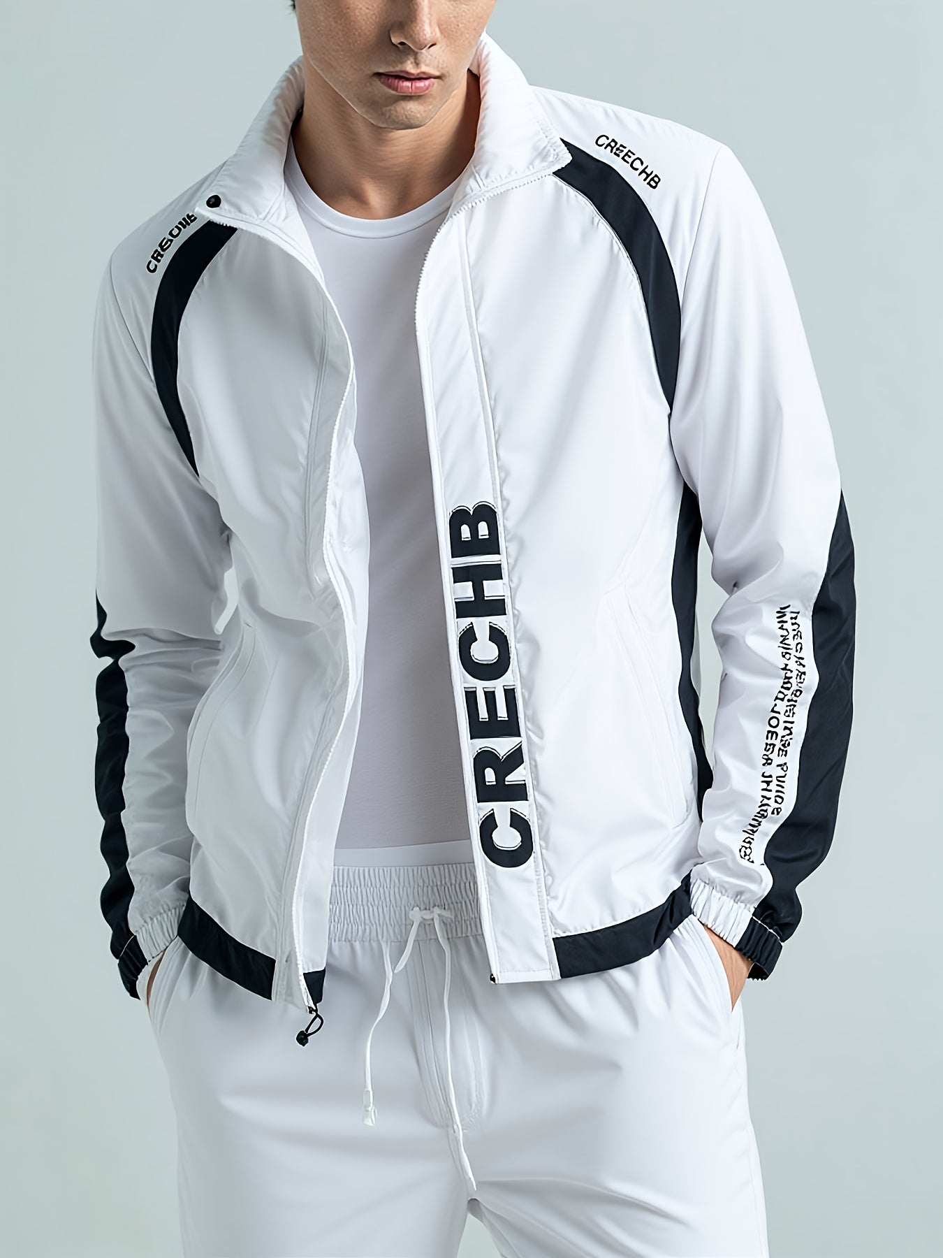 Գարնան և աշնան համար նախատեսված սպորտային հագուստի համալիր, որը ներառում է կանգնած օձիքով և սև ու սպիտակ գծավոր երկար տաբատով ճարմանդով բաճկոն, ոճային հանդերձանք, որը հիանալի նվեր է, քրտինքից պաշտպանված, միայն ձեռքով լվանալ, մարզումների համար աքսեսուար: